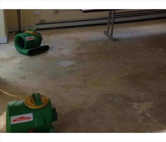 two air movers on concrete pad